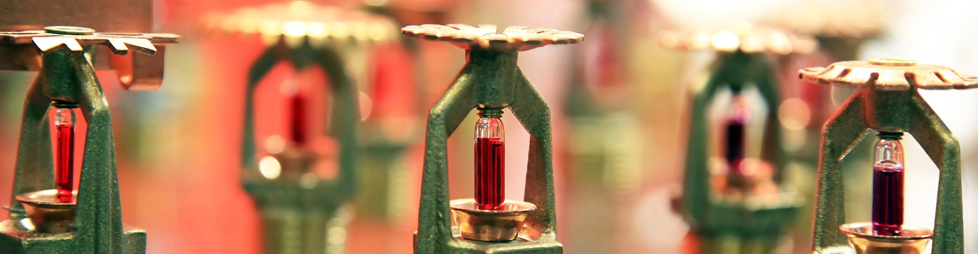 closeup of fire system sprinklers for common Fire Alarm Systems