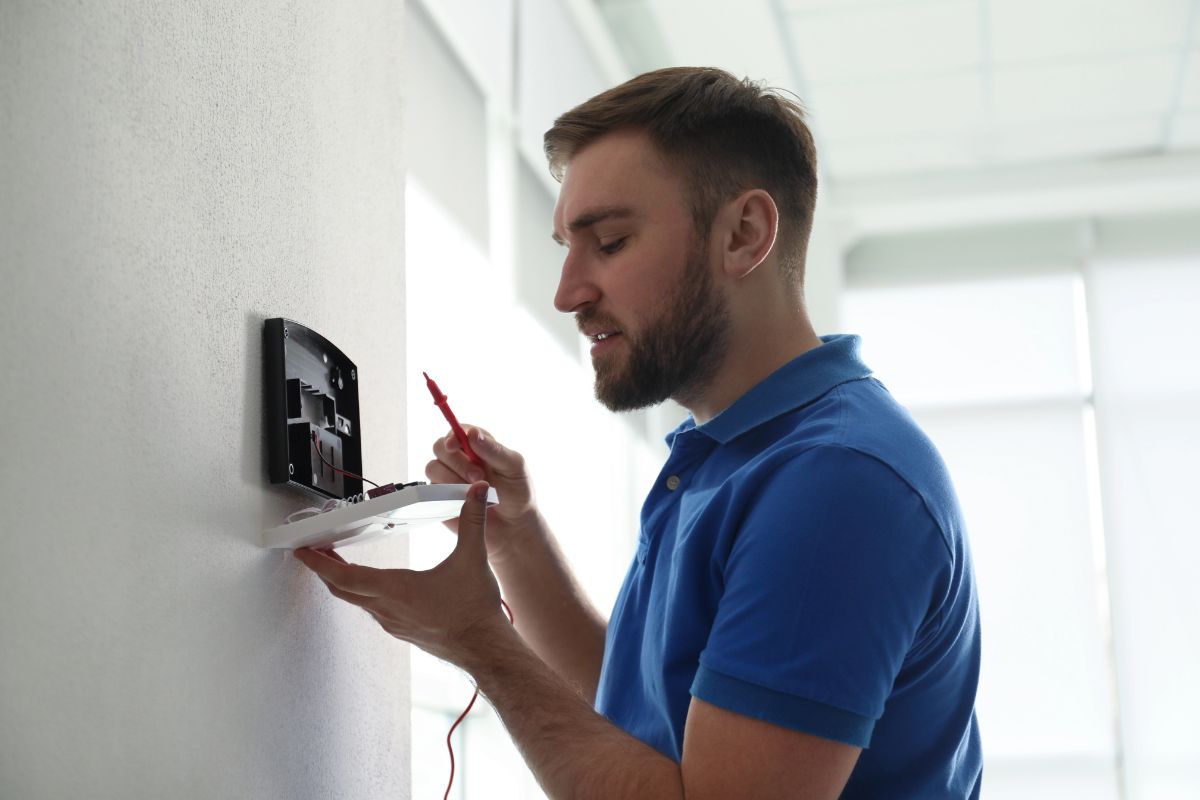 Contractor Performing a Home Alarm System Installation at a Home in Jacksonville Beach, FL